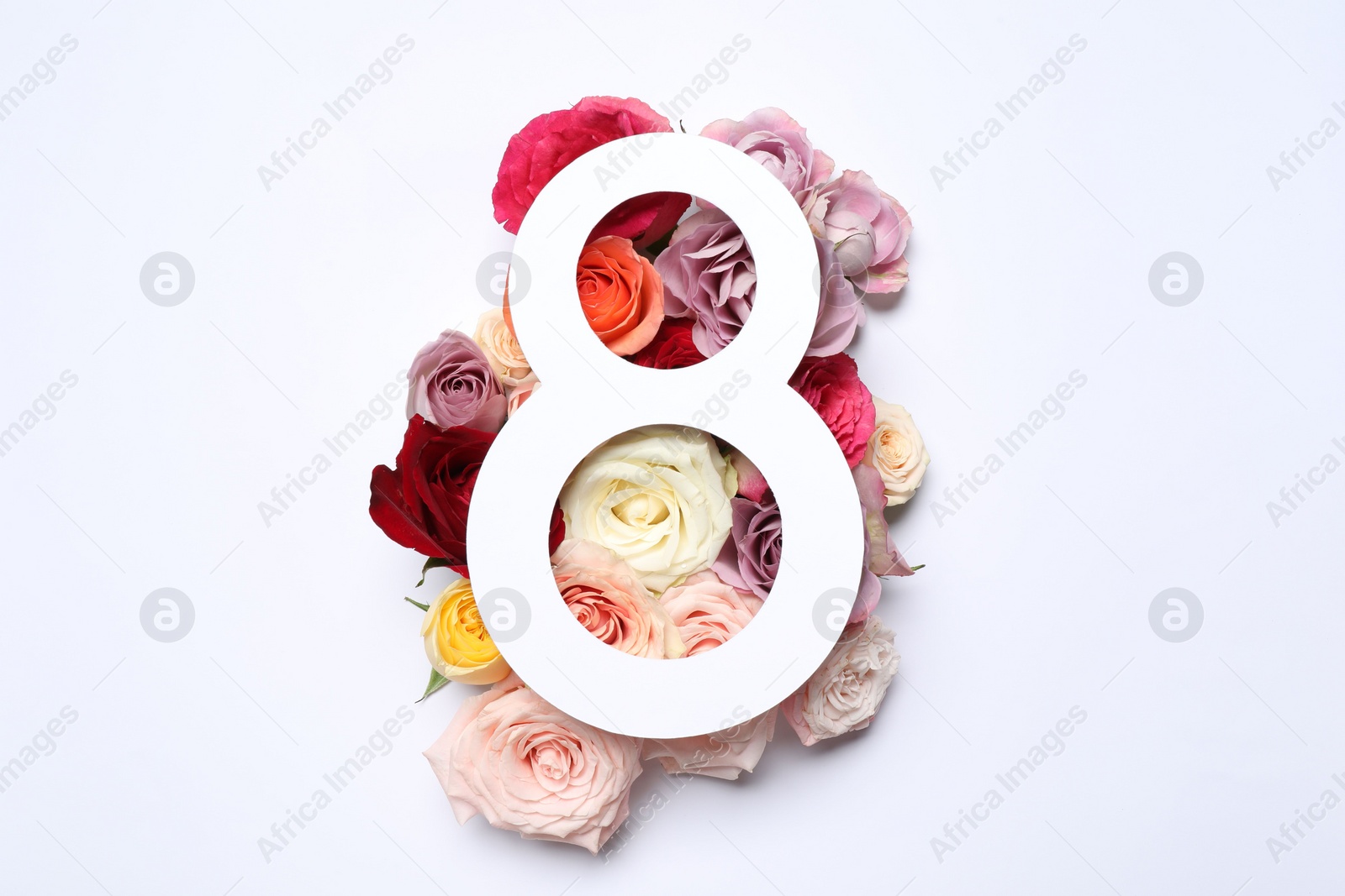 Photo of 8 March greeting card design with roses on white background, top view. Happy International Women's Day