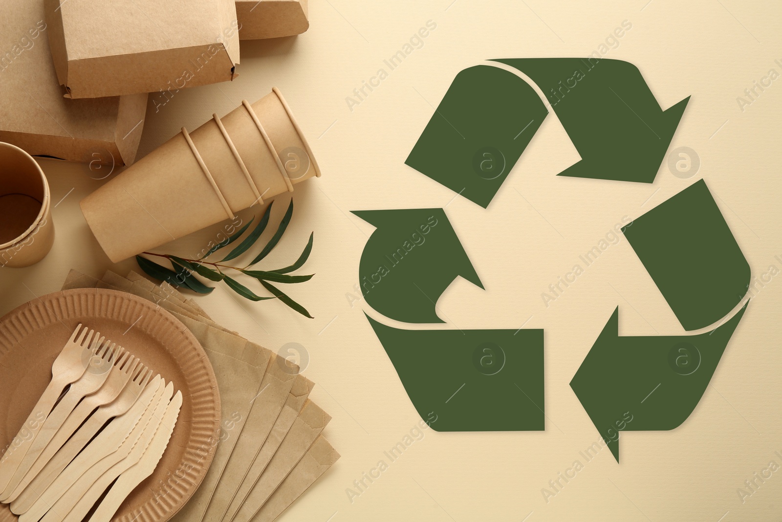 Image of Flat lay composition with eco friendly products and recycling symbol on beige background