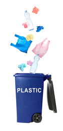 Image of Different plastic garbage falling into trash bin. Waste management and recycling