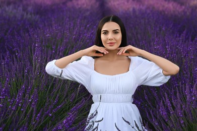 Portrait of beautiful young woman in lavender field