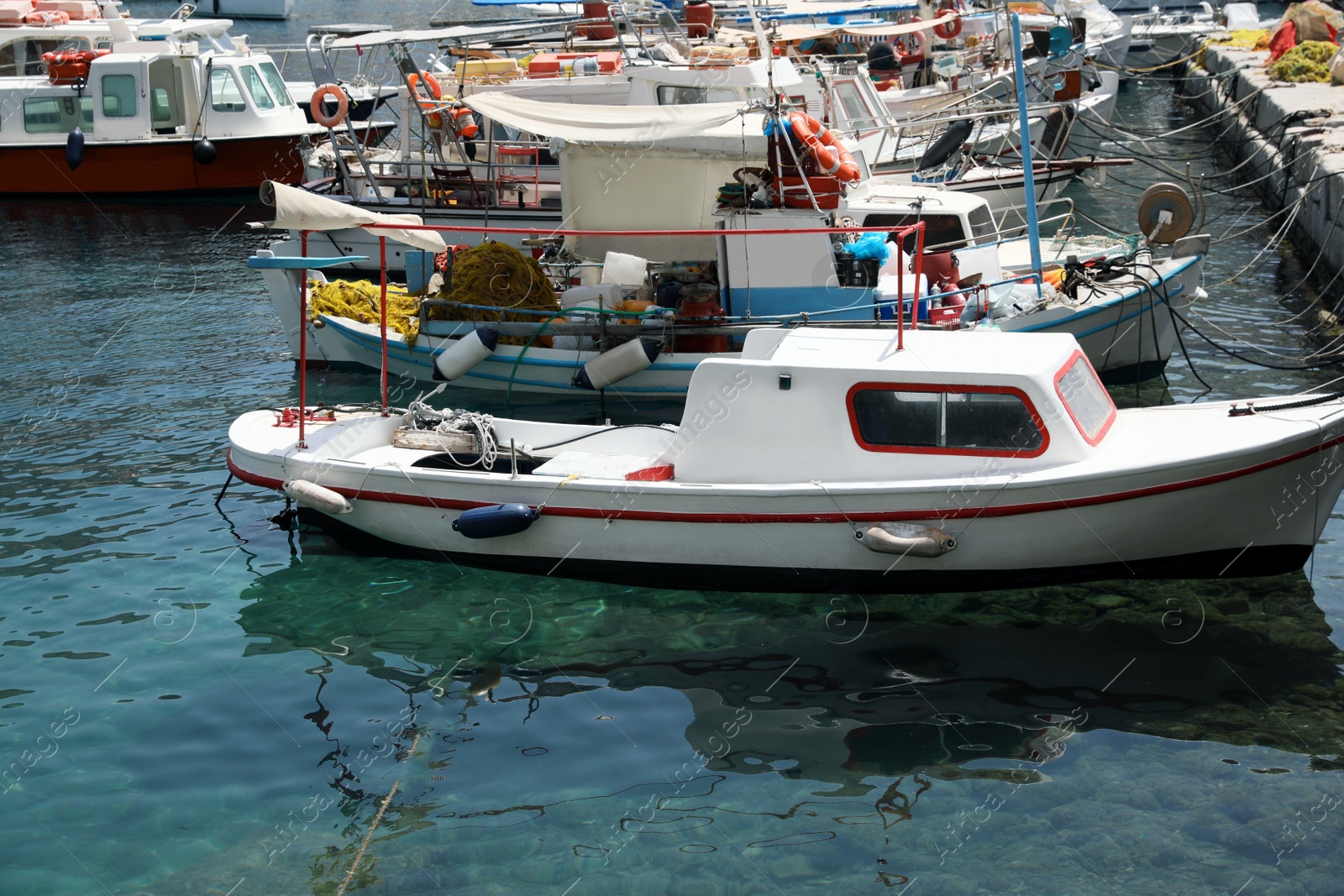 Photo of Beautiful view of coastal city with different boats on sunny day