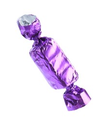 Tasty candy in purple wrapper isolated on white