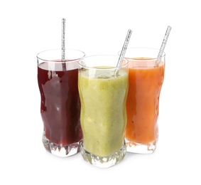 Delicious colorful juices in glasses isolated on white