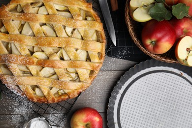 Delicious traditional apple pie on table, flat lay