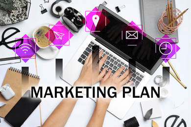 Image of Digital marketing plan. Woman working with laptop at table, top view