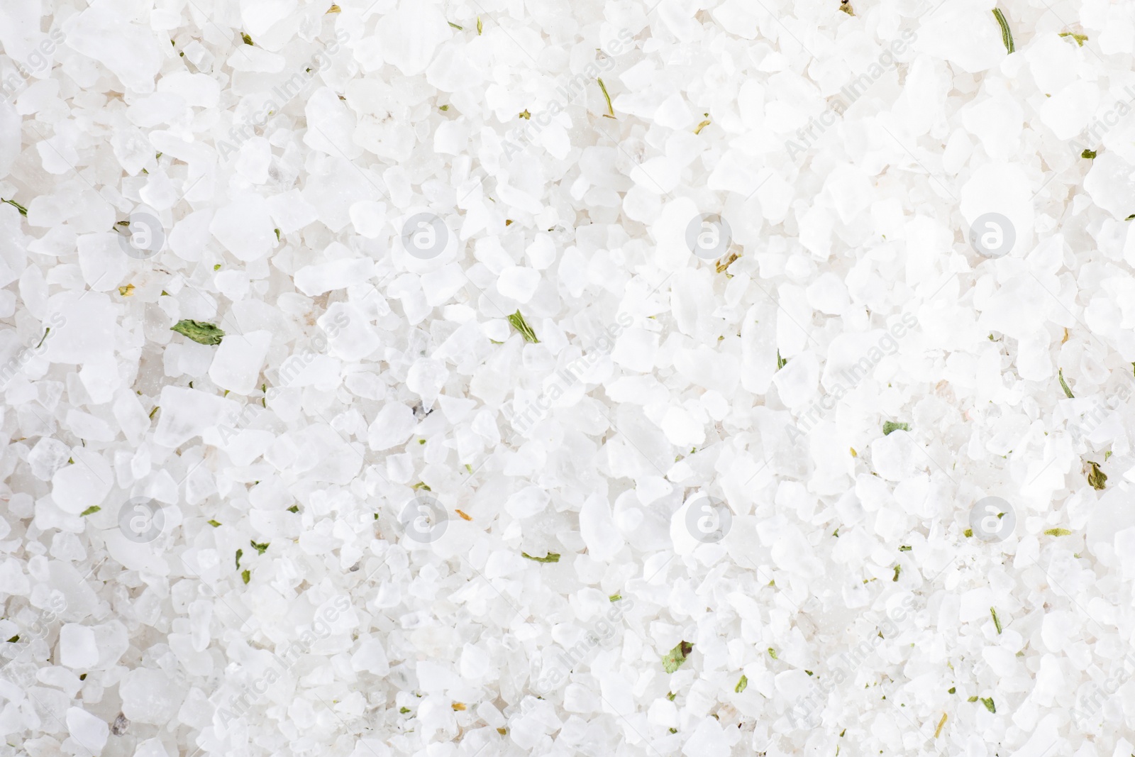 Photo of White sea salt as background, top view. Spa treatment