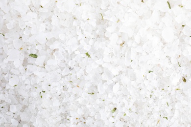 Photo of White sea salt as background, top view. Spa treatment