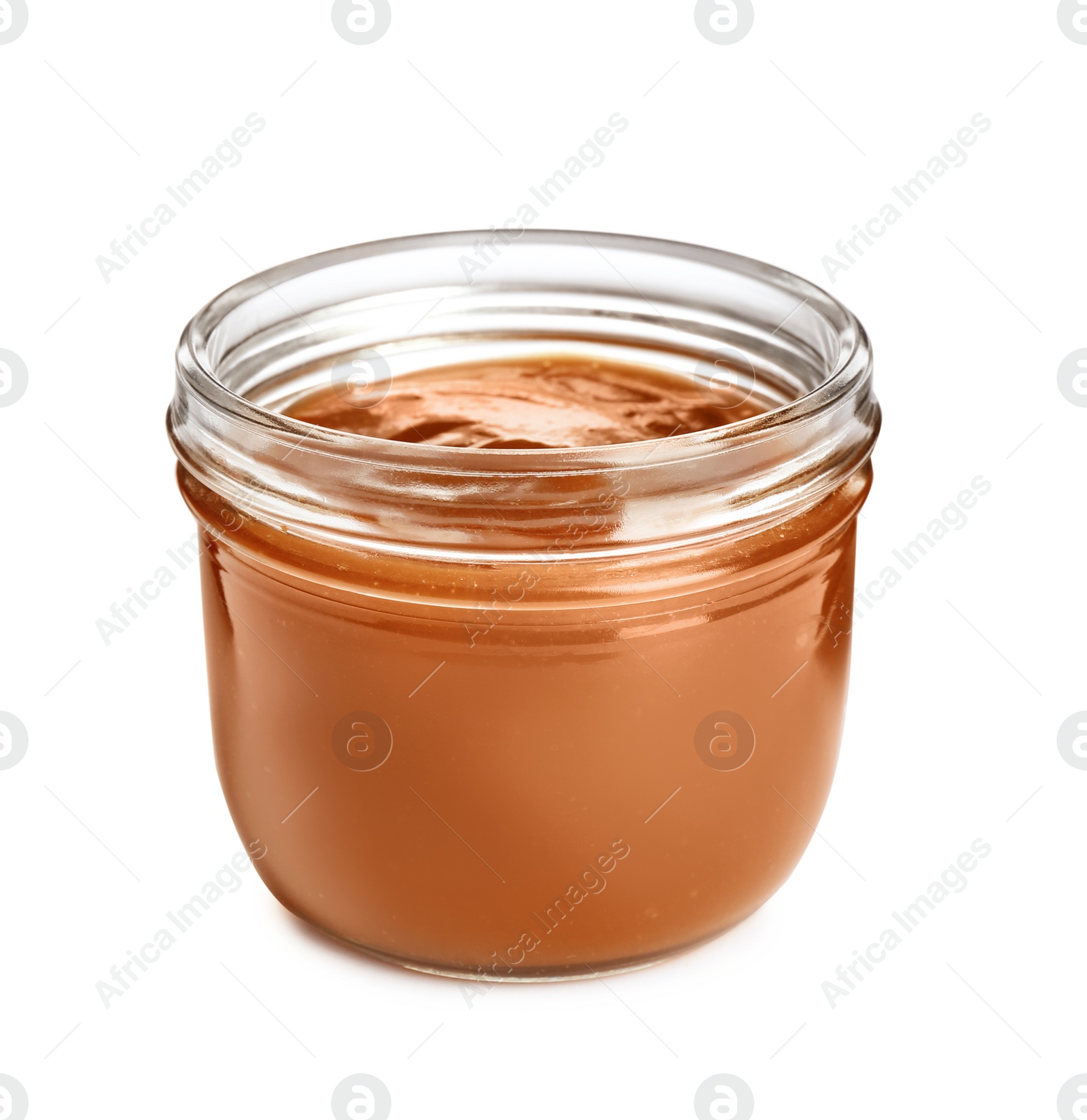 Photo of Jar of tasty caramel sauce isolated on white