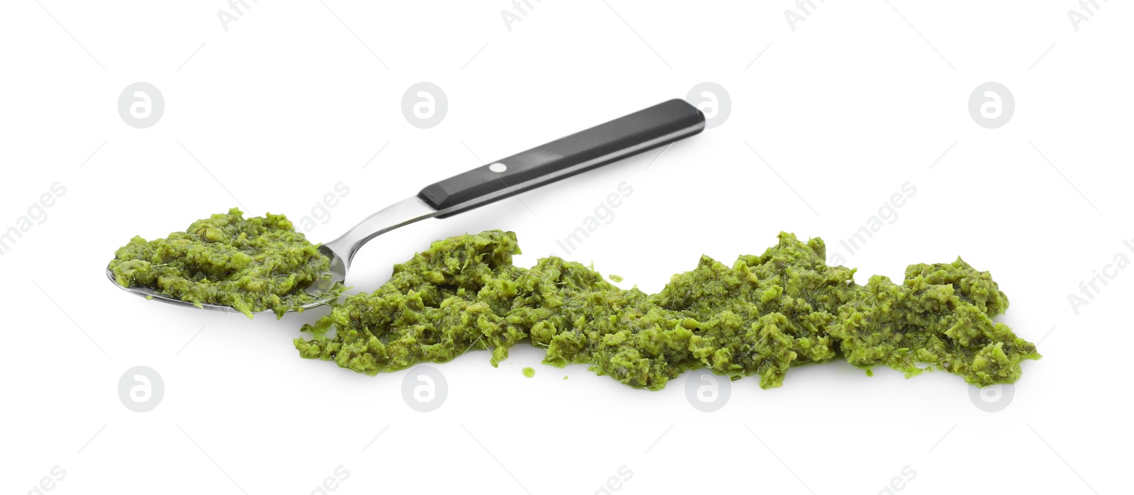 Photo of Spoon with delicious pesto sauce isolated on white