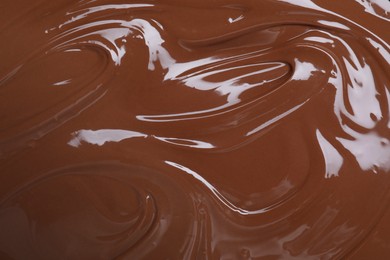 Photo of Tasty chocolate paste as background, closeup view