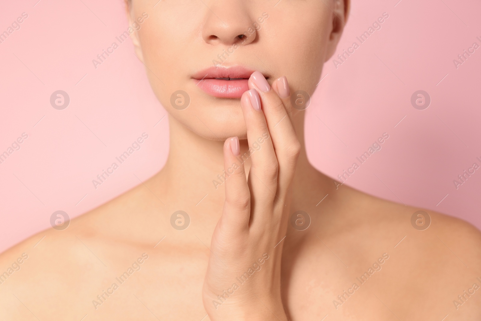 Photo of Closeup view of beautiful young woman on color background. Lips contouring, skin care and cosmetic surgery concept