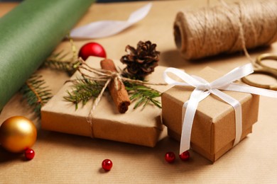 Photo of Beautiful gift boxes and decorations on wrapping paper. Christmas present