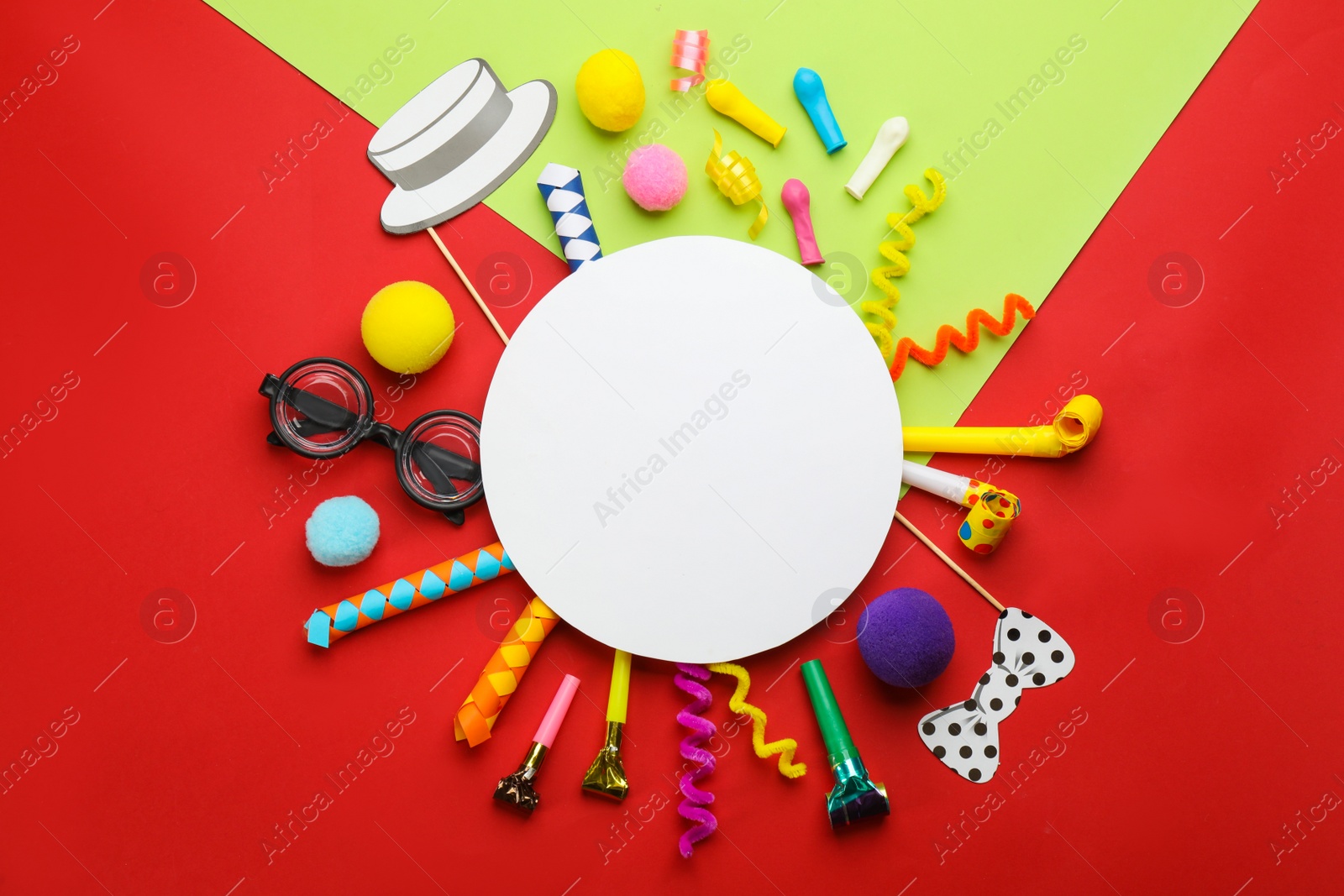 Photo of Flat lay composition with carnival items and blank card on color background. Space for text