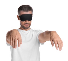 Photo of Man with eye mask in sleepwalking state on white background