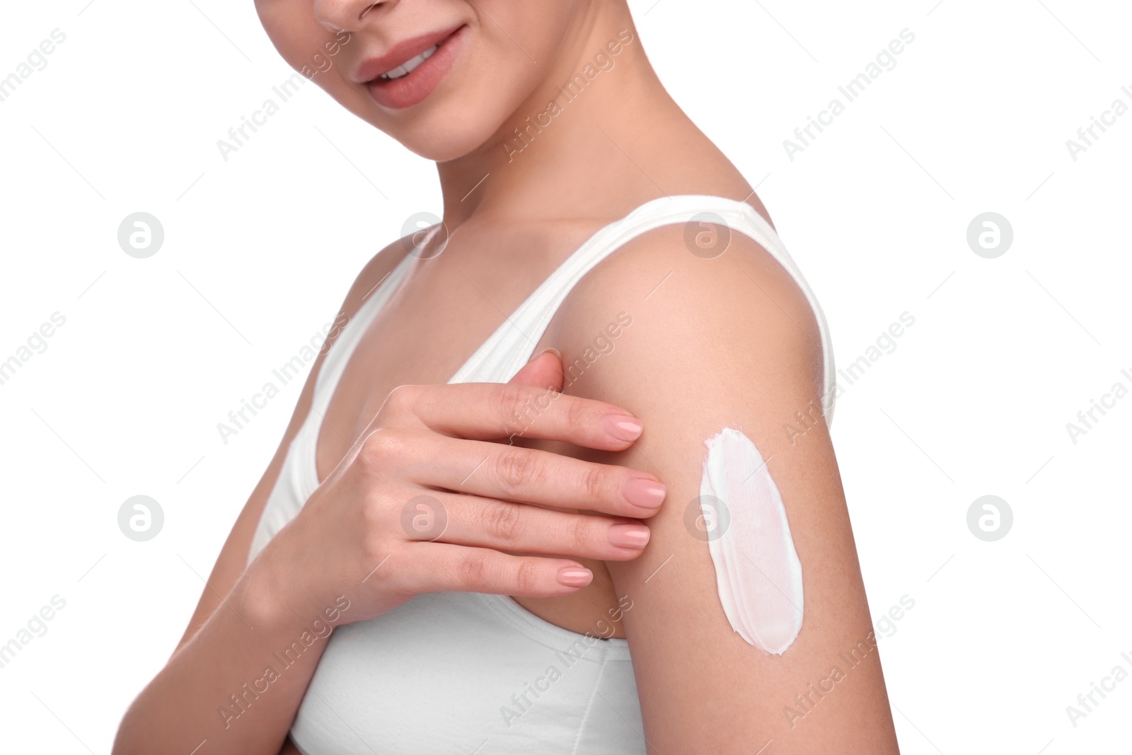 Photo of Woman with smear of body cream on her arm against white background, closeup