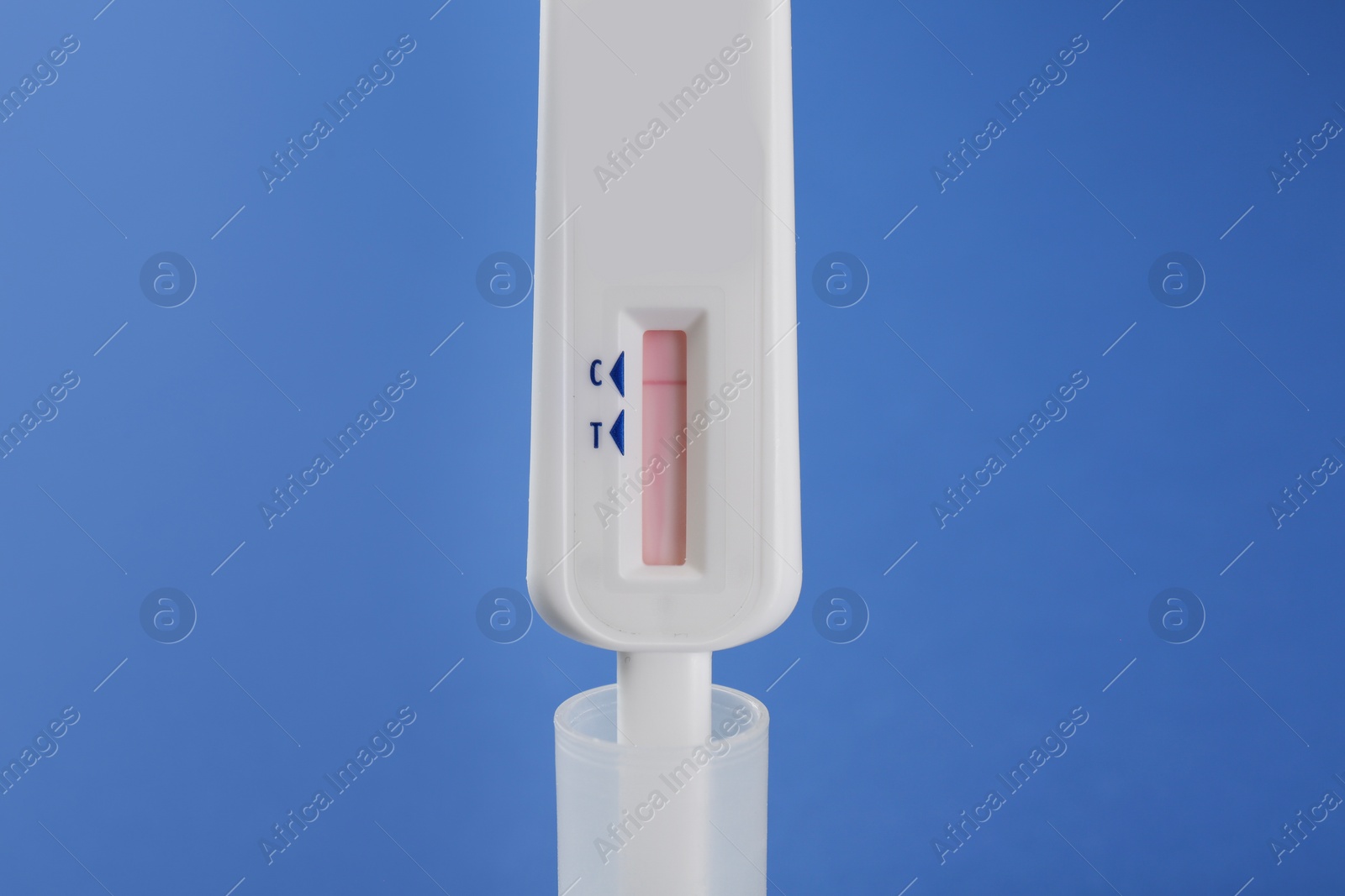 Photo of Disposable express test on blue background, closeup