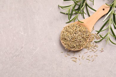 Photo of Dry and fresh rosemary on light grey table, flat lay. Space for text