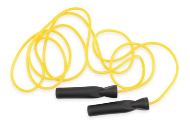 Photo of Yellow skipping rope isolated on white, top view. Sports equipment