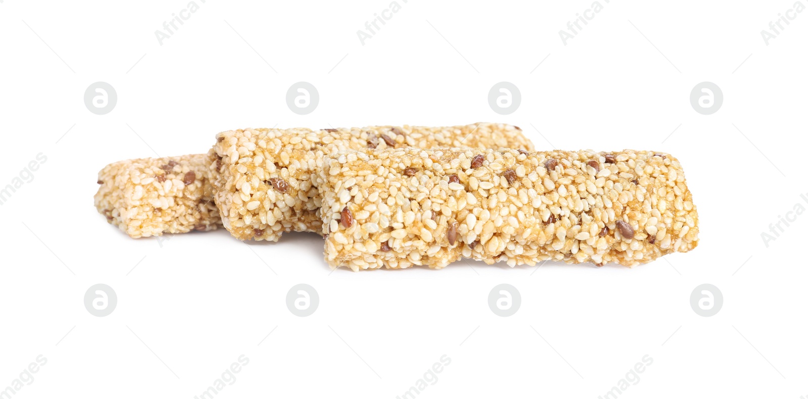 Photo of Tasty sesame seed bars isolated on white