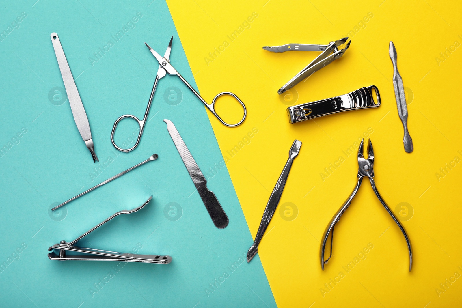 Photo of Set of manicure tools on color background, flat lay