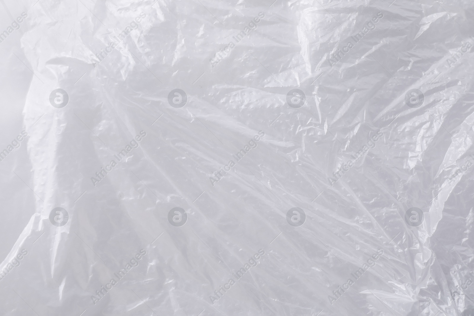 Photo of Texture of white plastic bag as background, closeup