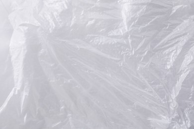 Photo of Texture of white plastic bag as background, closeup