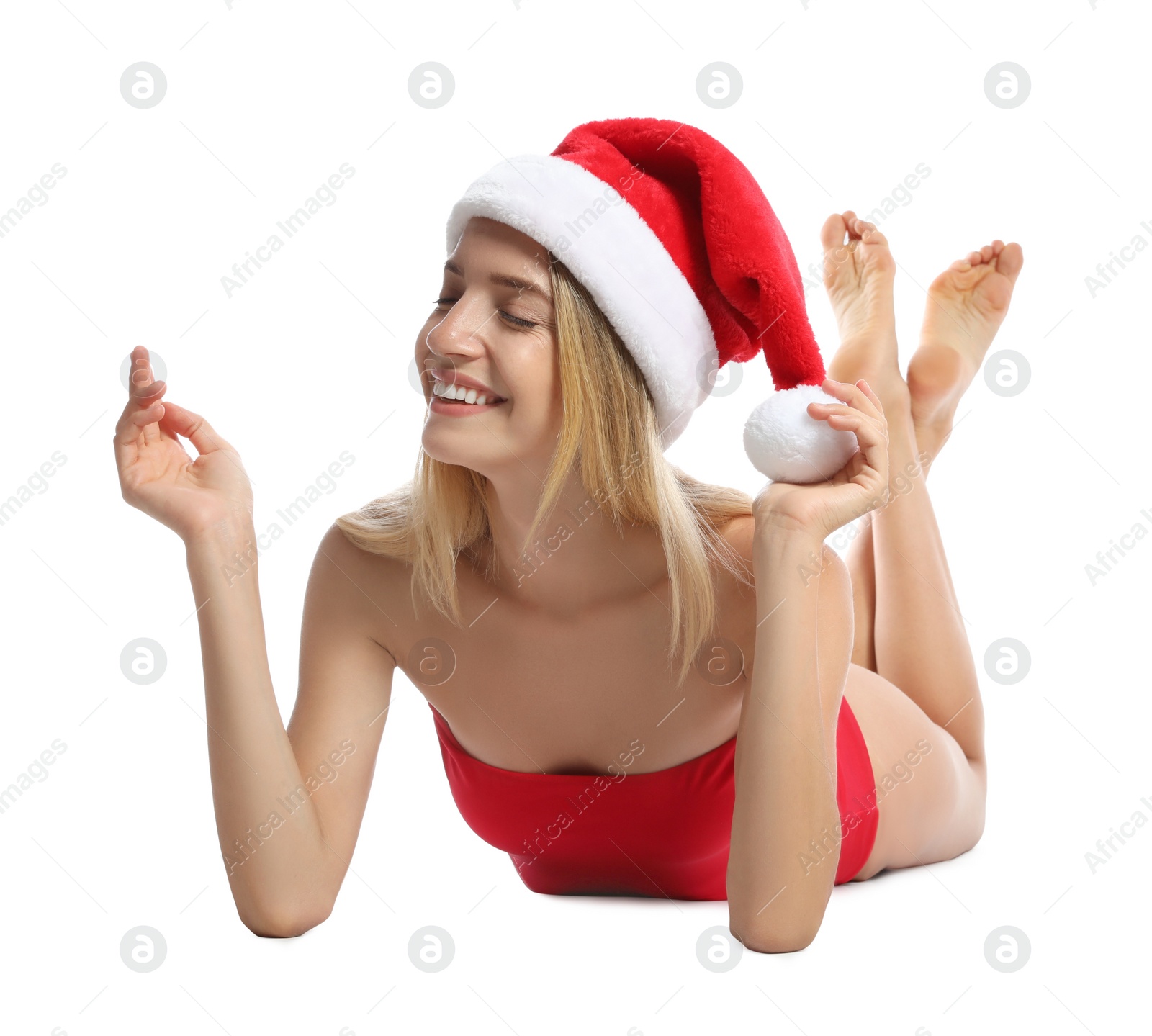 Photo of Young woman wearing Santa Claus hat on white background. Christmas vacation