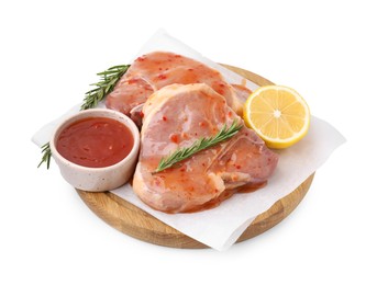Photo of Board with raw meat, marinade, lemon and rosemary isolated on white