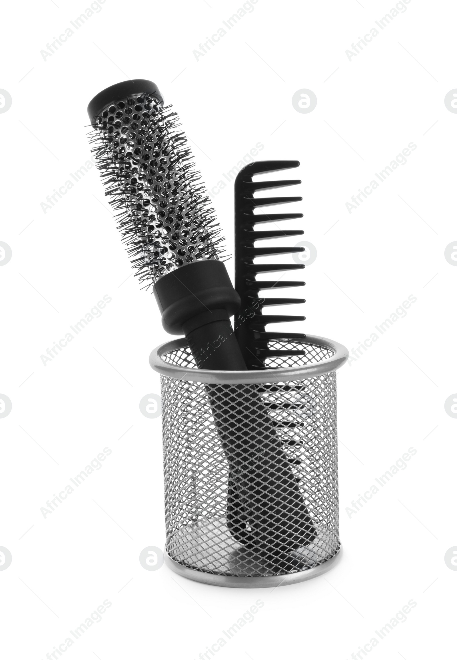 Photo of New modern hair brush and comb in metal holder isolated on white