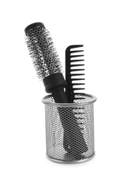 New modern hair brush and comb in metal holder isolated on white