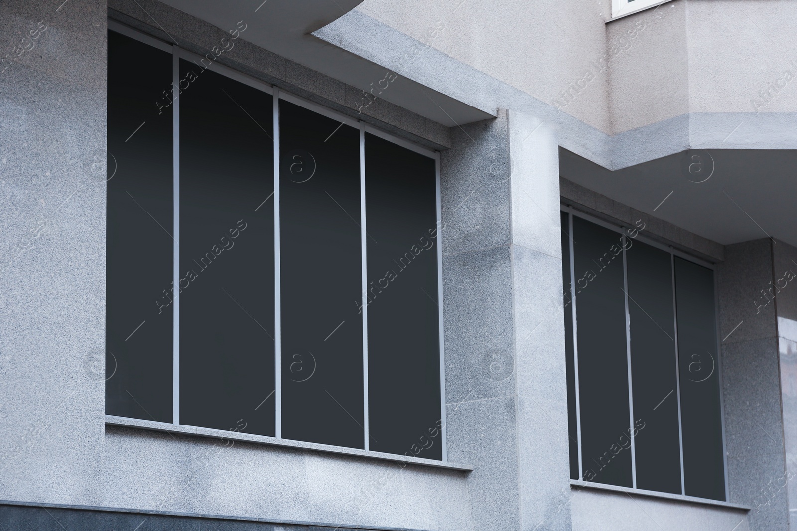 Photo of Modern office building with tinted windows. Urban architecture