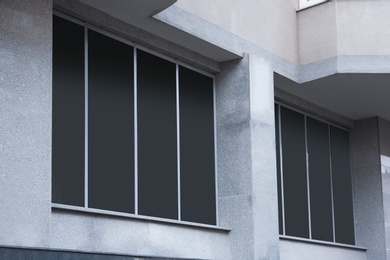 Modern office building with tinted windows. Urban architecture