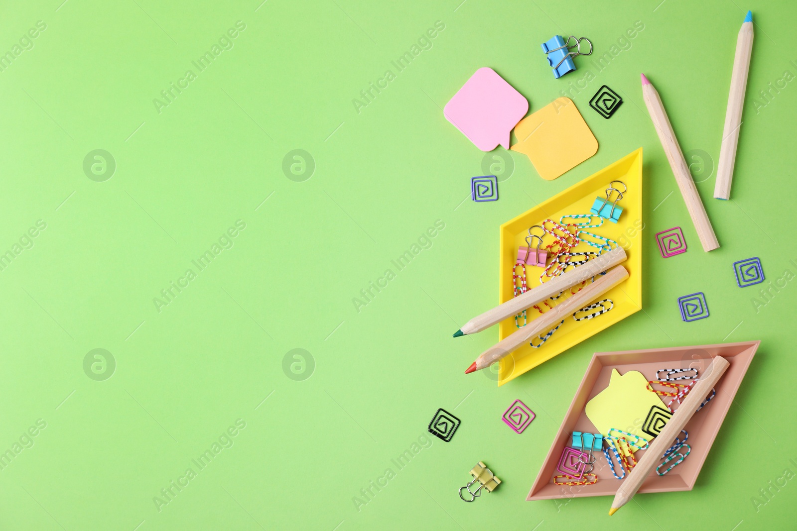 Photo of Flat lay composition with different  school stationery on color background. Space for text