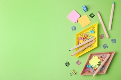 Flat lay composition with different  school stationery on color background. Space for text