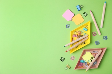 Photo of Flat lay composition with different  school stationery on color background. Space for text