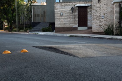 Speed bump on asphalt outdoors. Road safety