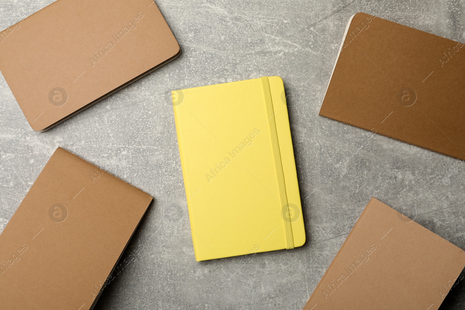 Photo of Different planners on grey table, flat lay