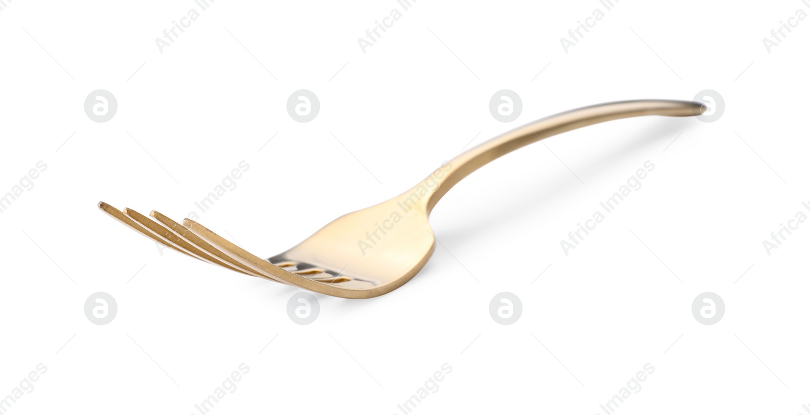 Photo of One shiny golden fork isolated on white