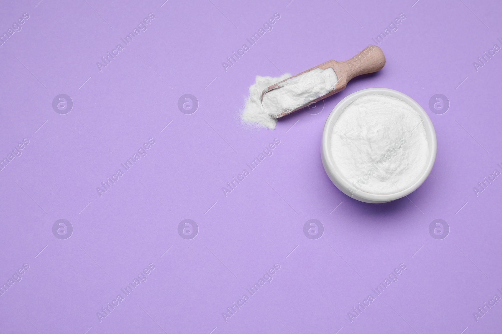 Photo of Sweet powdered fructose on violet background, flat lay. Space for text