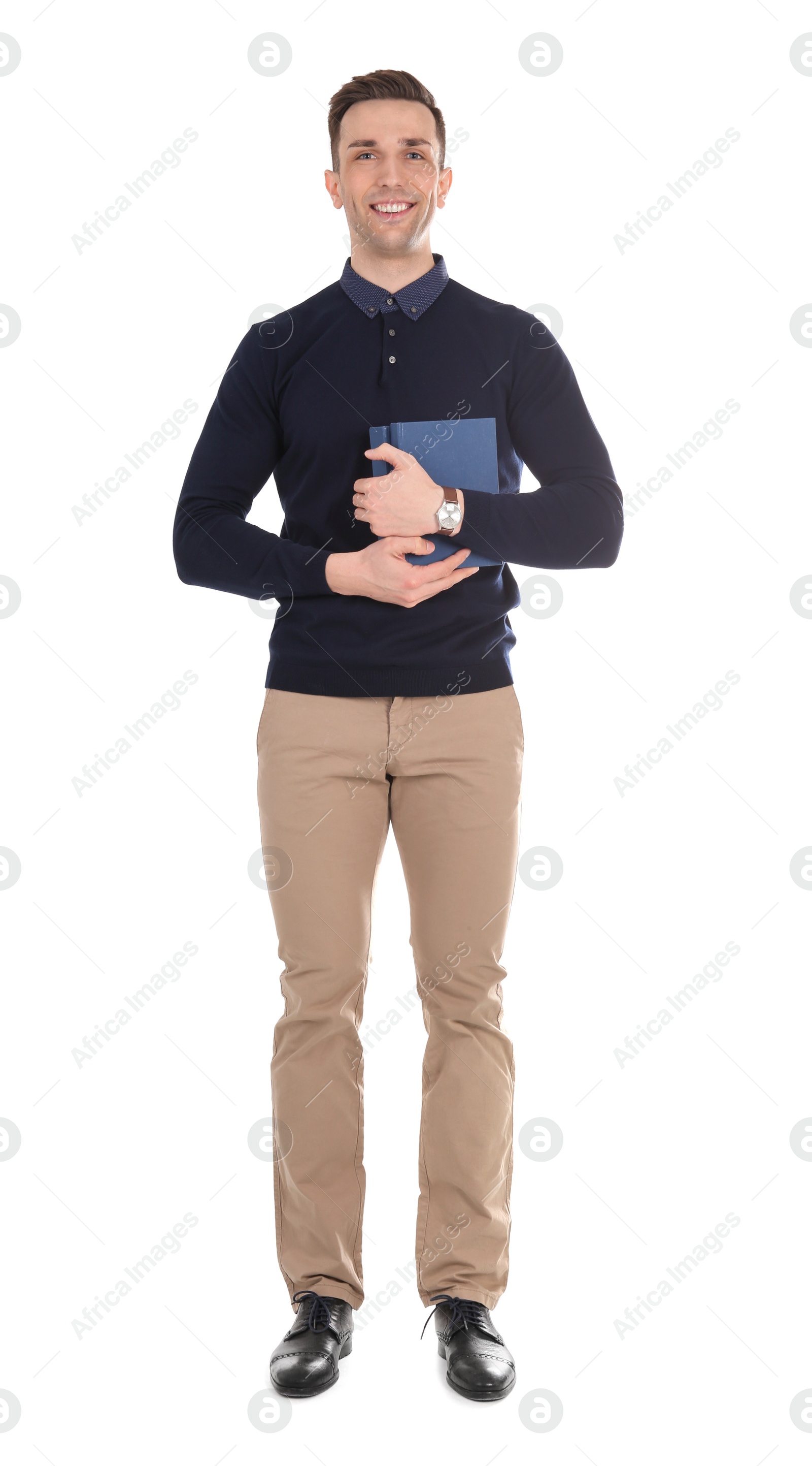 Photo of Young male teacher with books on white background