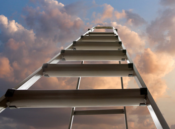 Image of Metal stepladder against sky with clouds, low angle view