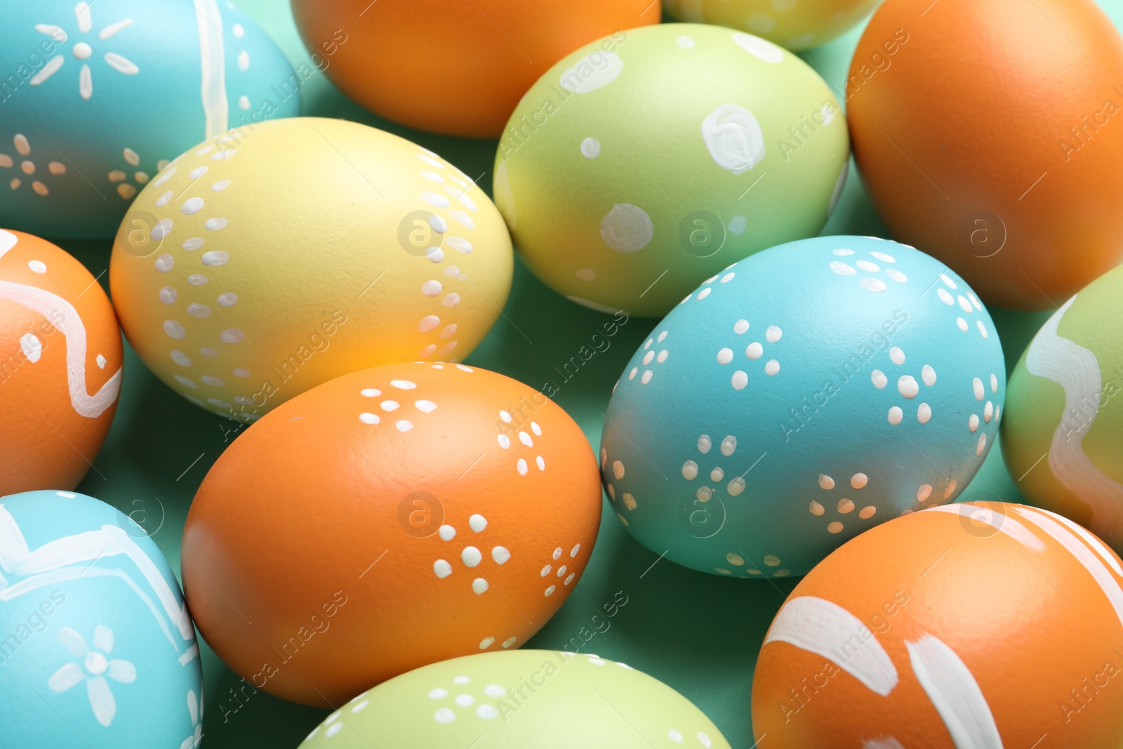 Photo of Many beautiful painted Easter eggs as background, closeup