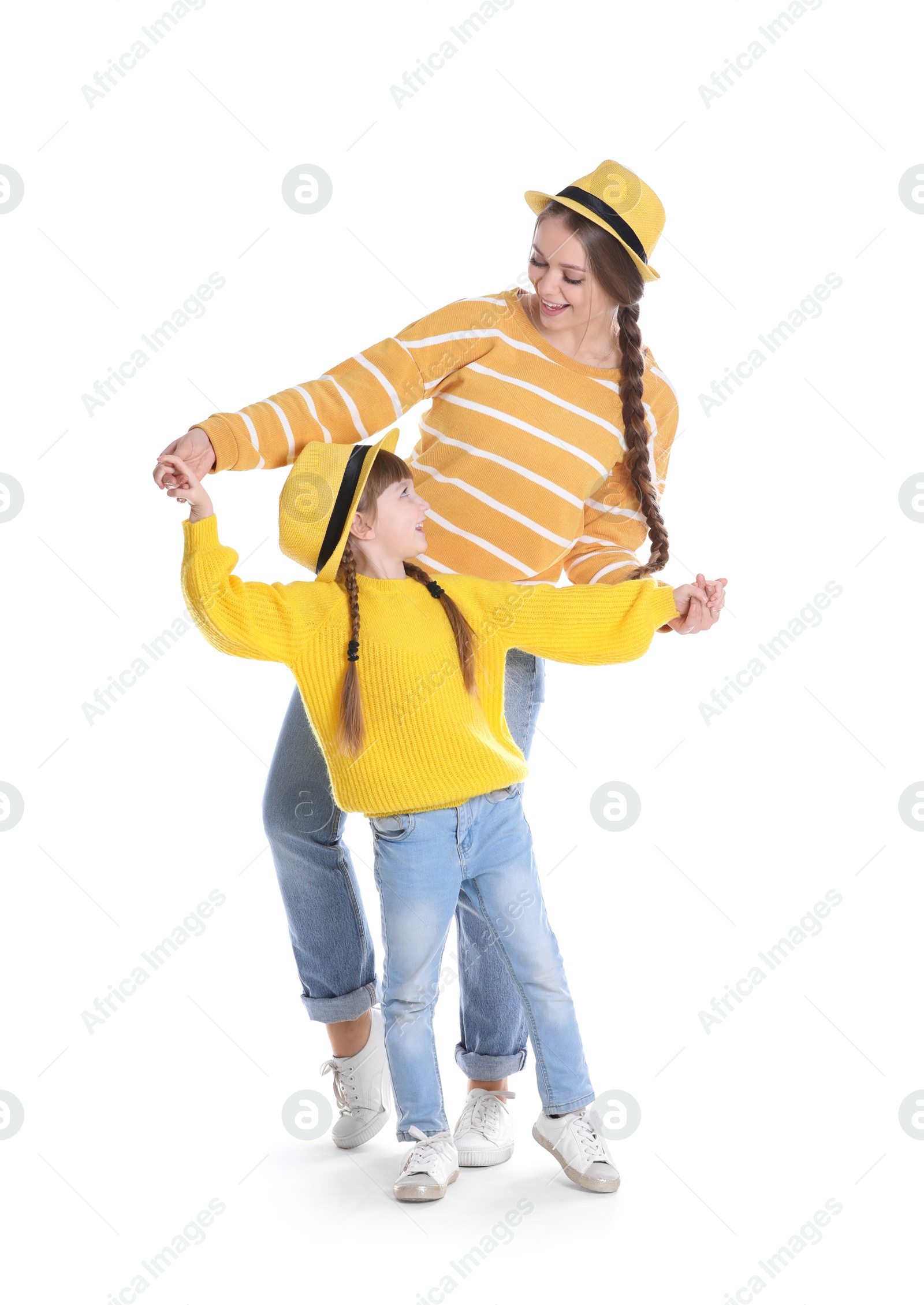 Photo of Happy woman and daughter in stylish clothes on white background