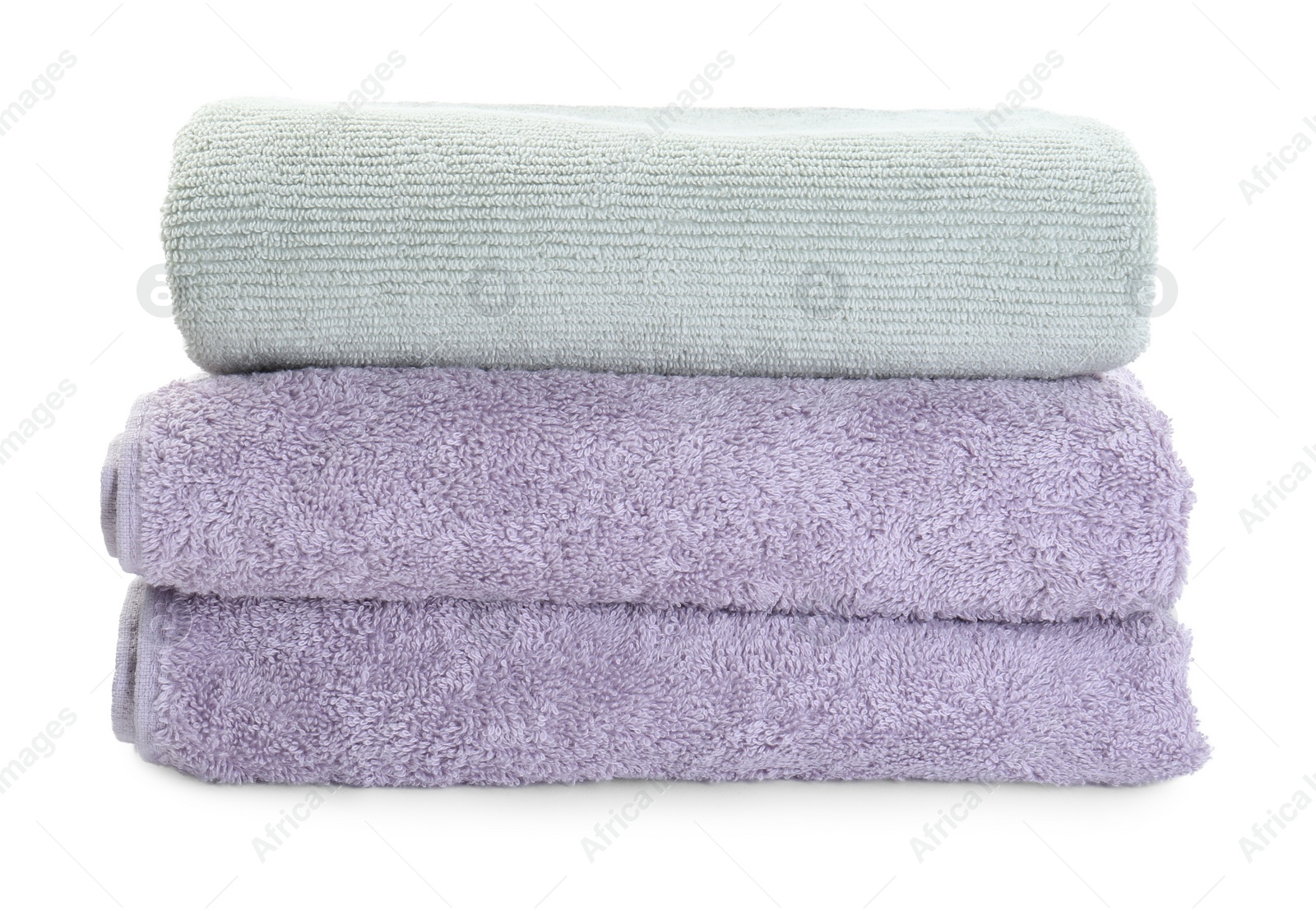 Photo of Stack of different folded terry towels isolated on white