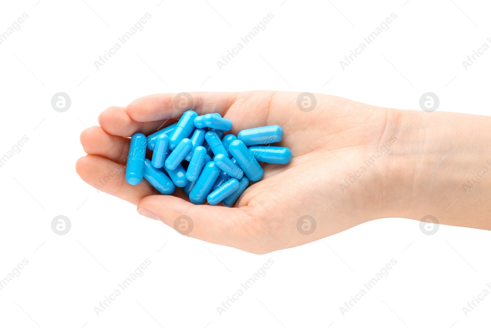 Photo of Woman holding color pills on white background, closeup