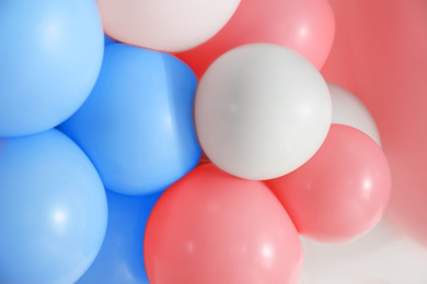 Image of Beautiful colorful balloons on light background, closeup. Party decor