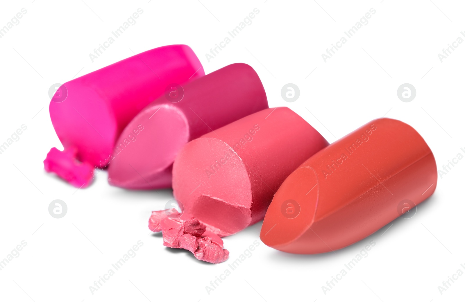 Photo of Many different bright lipsticks on white background