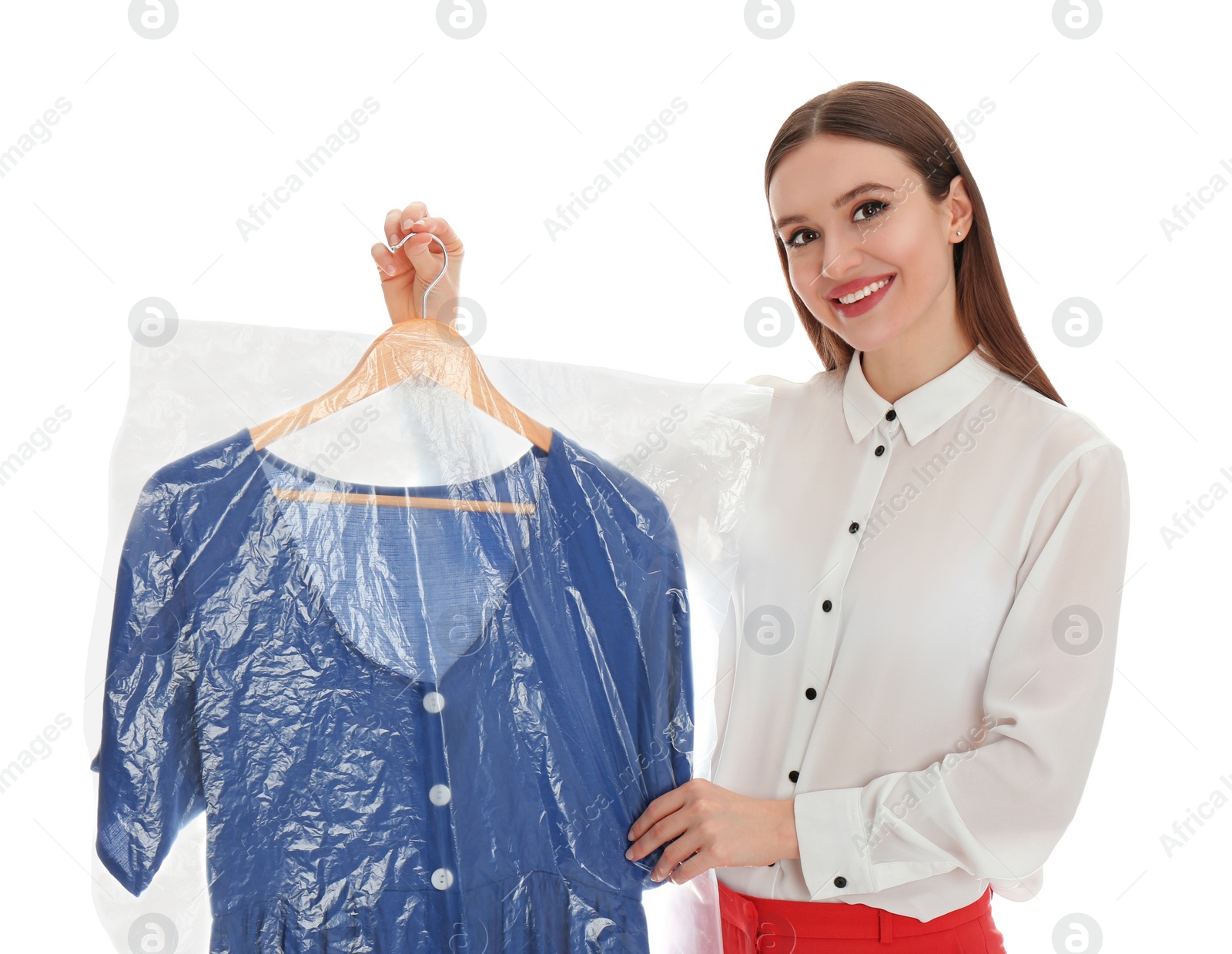 Photo of Young woman holding hanger with dress on white background. Dry-cleaning service