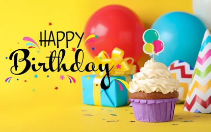 Image of Happy Birthday! Delicious cupcake and party decor on yellow background