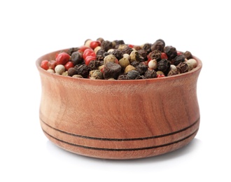 Photo of Wooden bowl with peppers mix on white background. Different spices